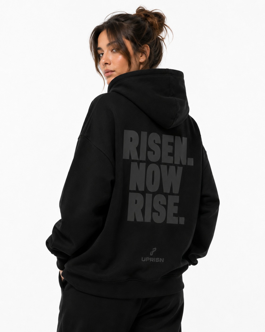 Model wearing UPRISN Christian hoodie in Black, back print